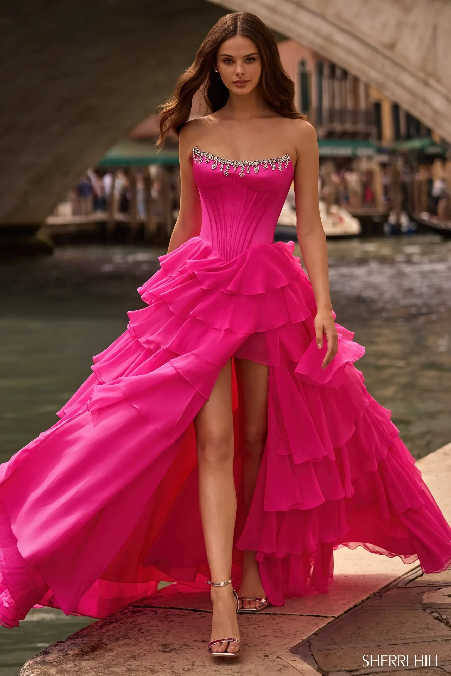 Model wearing a gray gown by by Andrea & Leo