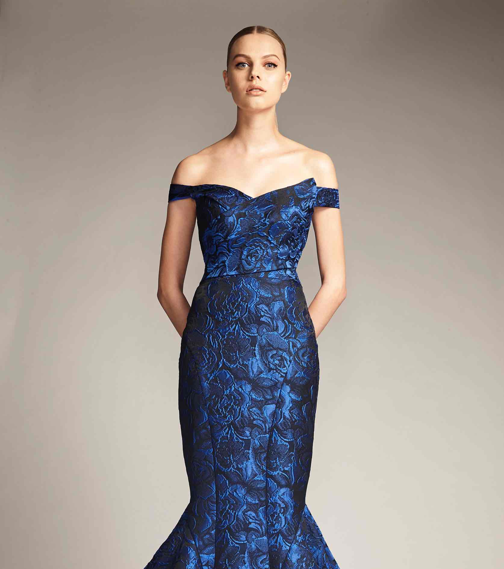 Model in blue patterned off the shoulder Park 108 gown