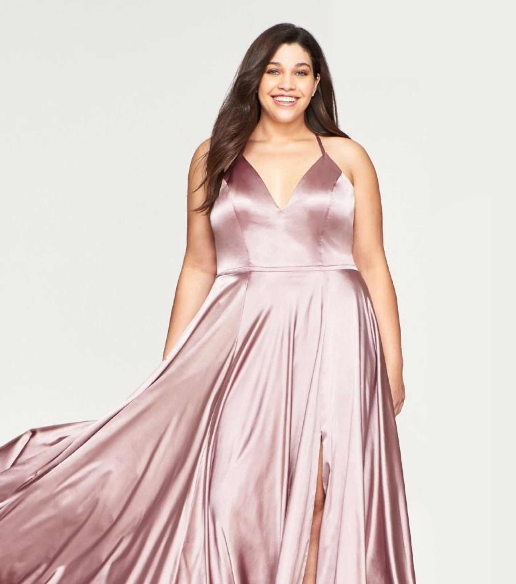 Plus size model in blush satin Faviana dress